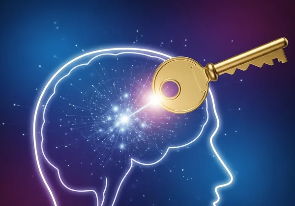 A key unlocking a stylized brain, representing self-discovery
